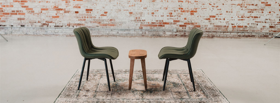 {THE AND} production set with 2 chairs and small table.