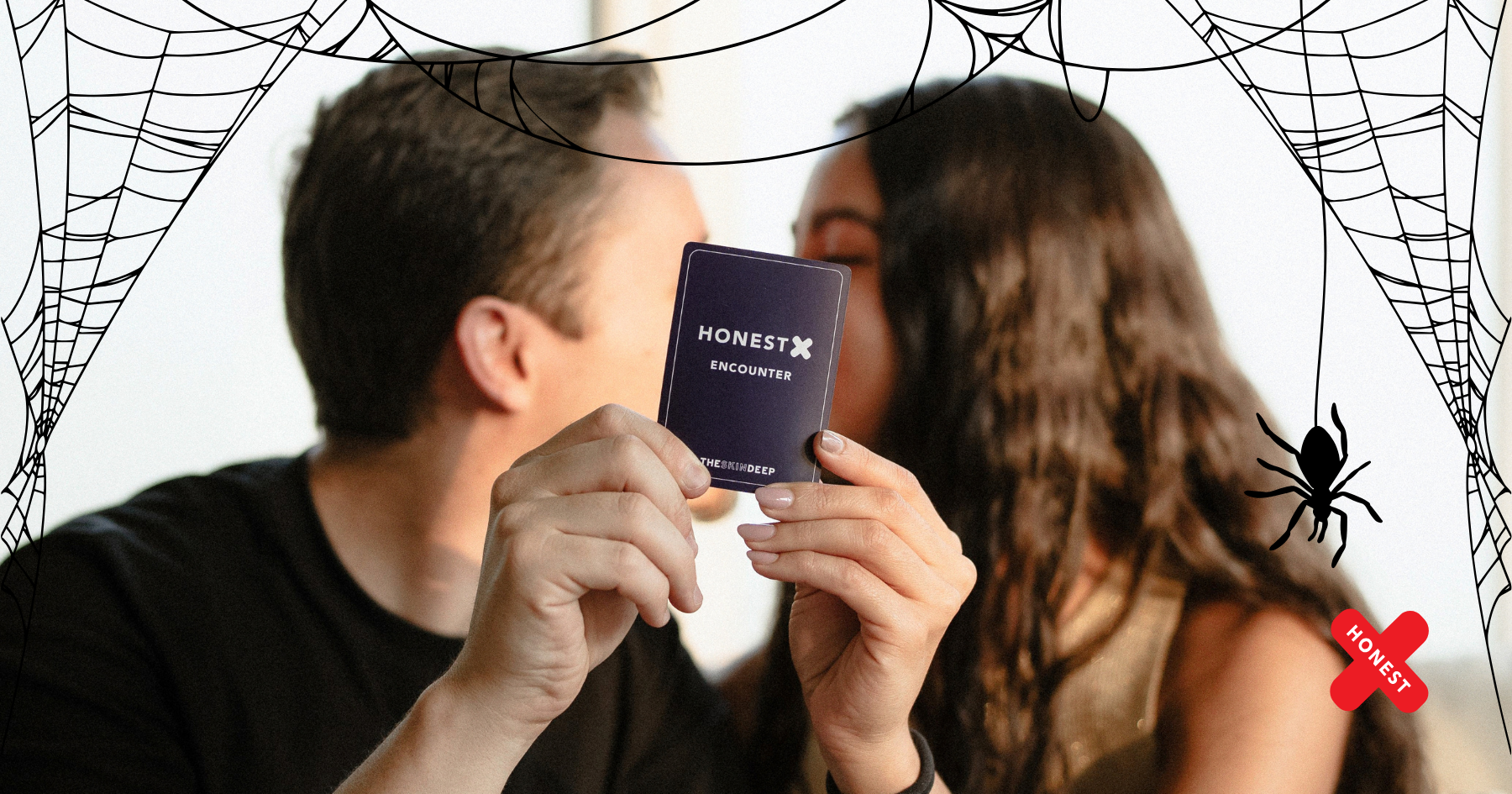Picture of a couple kissing and holding an Honest X card