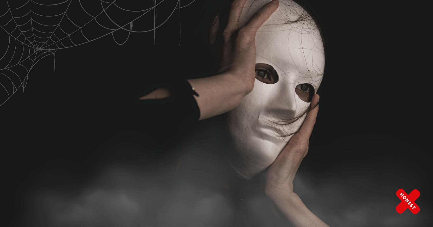 Picture of a woman wearing a white mask and holding her face