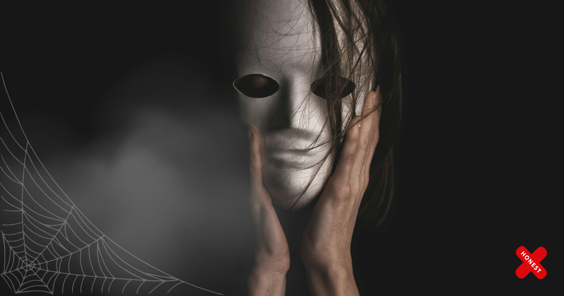 Picture of a woman wearing a white mask and holding her face