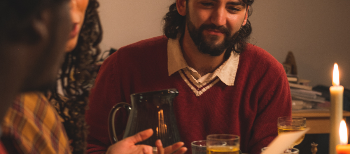 Dinner party guests making a connection through conversation