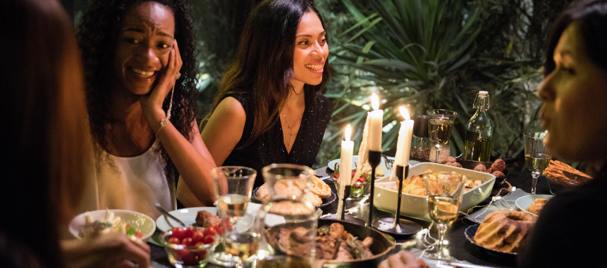 Dinner party guests having a deep conversation