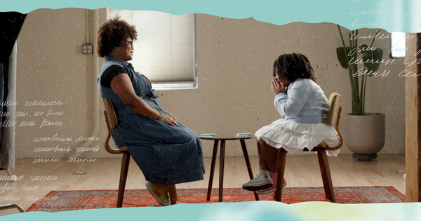 Picture of mom and daughter sitting face to face talking and laughing